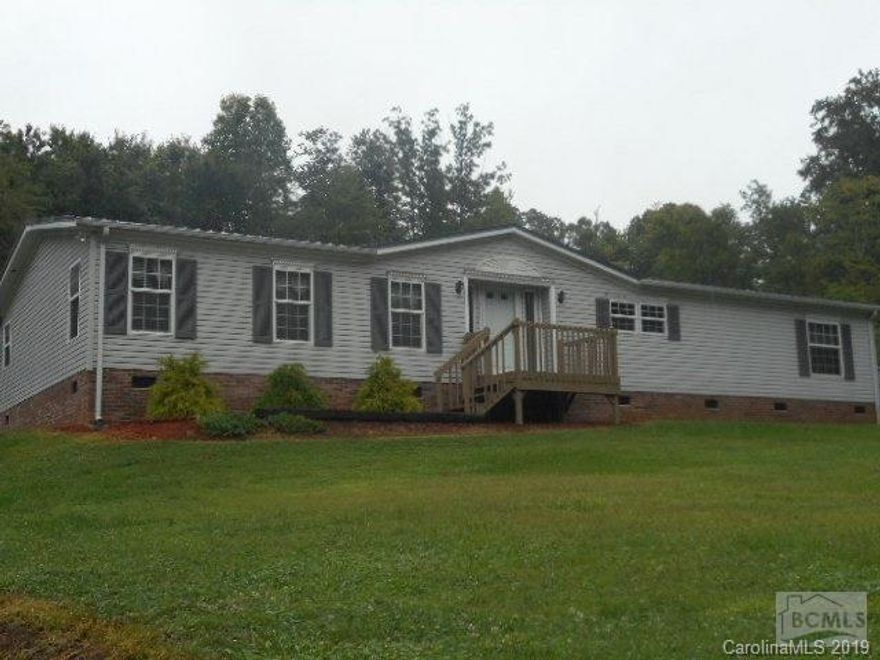 LIKE NEW 3 bedroom 2 bath home just minutes from Hictoric Valdese NC. This home has been meticulously maintained and shows like new. The easy living single level floorplan has an open concept main living area including a spacious living room w vaulted ceilings and gas log fp, formal dining room, and kitchen w all appliances,a pantry,and sit-down bar.The oversized master suite is a perfect retreat from the daily grind with walk-in closet,a sitting area,and private full bath featuring a dbl vanity,soaking tub,and walk-in shower.Opposite end of home is 2 addt bedrooms,a 2nd full bath,and the laundry room.Interior updates inc new laminate flooring and all new light fixtures/fans.The ext is low maint vinyl and boasts 2 decks,outbuilding,det dbl carport,and a new metal roof.Home is just perfect for the 1st time buyer or the downsizer,and comes with a 1 year home warranty!