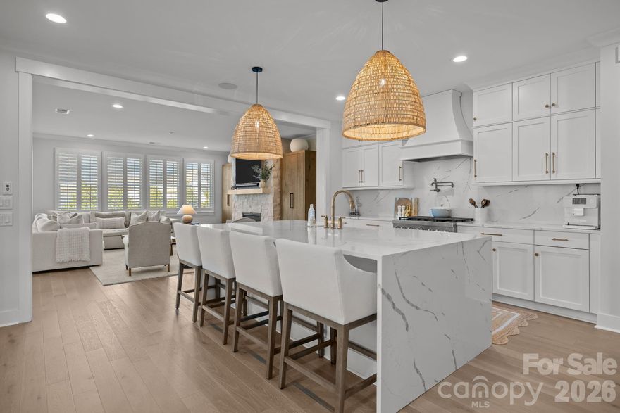 Step into modern luxury with this 2024 full brick home, where elevated design meets effortless, boho-inspired style. Offering 4 bedrooms and 4.5 baths, every space has been thoughtfully designed for both comfort and elevated everyday living.
At the heart of the home, the chef-inspired kitchen features quartz countertops, a striking waterfall-edge island, and an ideal layout for both casual meals and entertaining. The open-concept design flows seamlessly into the living area and out to the screened porch, where a multi-sliding door creates true indoor-outdoor living, perfect for morning coffee or evening gatherings.
Engineered wood floors span the main level, adding warmth and continuity throughout. The primary suite offers an elegant private retreat with a spa-like bath featuring a soaking tub, oversized walk-in shower, and a large walk-in closet. Additional bathrooms showcase elevated finishes, while the guest suite stands out with beautiful Carrera marble, creating a refined and welcoming space for family and visitors.
Designed with intention, this home perfectly balances luxury and function, where comfort meets style and every detail enhances daily living. Whether hosting or unwinding, you’ll appreciate the seamless blend of sophistication and livability.
Located in the highly sought-after Arden Mill community, this nearly new home offers the opportunity to start and end each day in comfort, style, and luxury.