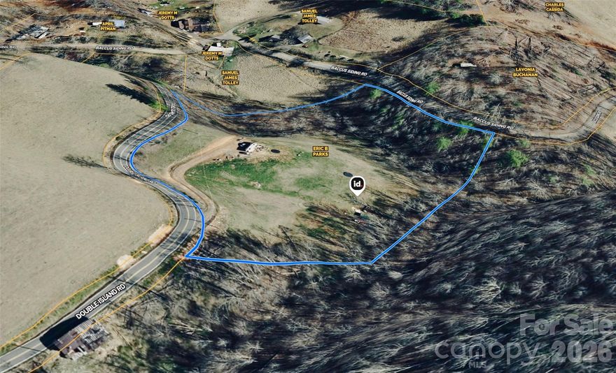 Build your dream home, vacation home or family compound on 6.78 unrestricted acres.  Surround yourself with the beautiful mountains of WNC with this unique property that has a well, 3 bedroom septic with basement, electric, level driveway and cleared area ready for your creativity to be unleashed!  Current homesite is located on cleared hilltop overlooking entire property.  Property includes various vegetation: Apples, pears, plums, raspberry, blueberry, blackberry and rosemary.  Two creeks converge at edge of property that borders Baccous Siding Road.  Well is 305 foot with 15gpm.