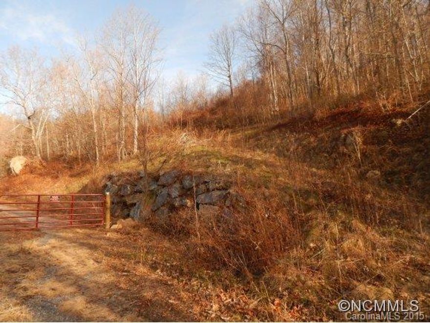 Private small subdivision has easy year round access and long range views of Cold Mountain and Shining Rock wilderness area.  Nice wooded lot has already been evaluated for septic and house pad and driveway installed.  Ready to build!