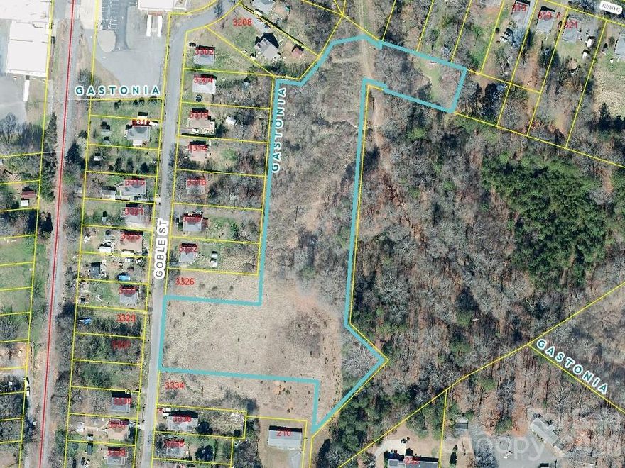 Nice Buildable, Mostly Flat Lot!  Property has been annexed with the City of Gastonia.  City water is available on street.  City sewer access available in the back of the property but septic is also allowed.  Duke Energy will have inactive power lines removed by end of February 2026.