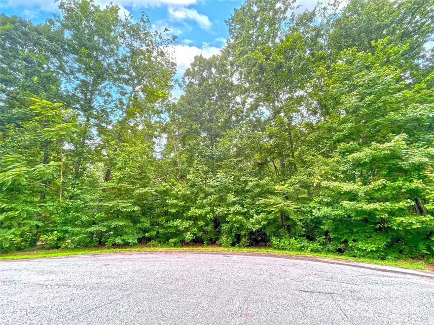 This pretty wooded lot in the Berkshire community offers nearly 2 acres in a private, tucked-away cul-de-sac. The topography is mostly level and many of the trees are hardwoods. The neighborhood features large homesites, mature trees, beautiful custom homes, street lights, and low HOA dues. Only a few miles east of Mooresville on Hwy 801 in the quaint farming community of Mt. Ulla, this lot is convenient to everything Mooresville offers, yet gives you the opportunity for peaceful, low-traffic living. There's a septic permit for a 4-bedroom system already in place, plus a well permit (both permits valid through 3-3-28), allowing you to save a few steps on your build! There are no time limits on when to build and you get to choose the builder. Come build your dream home in Berkshire!