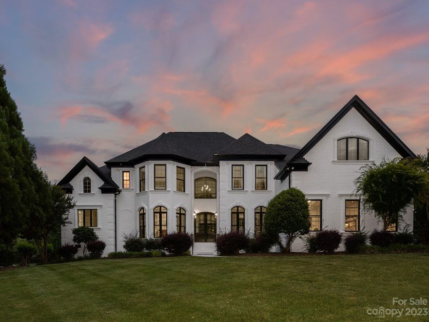 LUXURIOUS fully remodeled 5 bedroom/5 full bath home in popular Providence Downs community. Primary on main  with sitting area with fireplace + opulent primary bath with marble floors, vessel tub, custom tiled shower + large walk in closet. Separate study on main w/coffered ceiling & fireplace plus floor to ceiling windows. Lovely 2 story living room provides tons of natural light. Beautiful kitchen features KitchenAid commercial range with 2 ovens, 6 gas burners + vented hood, additional wall oven & microwave, wine fridge, marble tops and backsplash and LARGE walk in pantry. Upstairs you will find 2 ensuite secondary rooms, 2 oversized secondary rooms with shared bath + a 462sf bonus room! All 5 bathrooms fully remodeled! Don't miss the spacious laundry room with pet washing station. Whole home painted both inside and out! Refinished hardwood floors. Lovely outdoor area includes covered lanai plus wood burning fireplace & built in grill. Wonderful fully fenced backyard! 3 car garage!