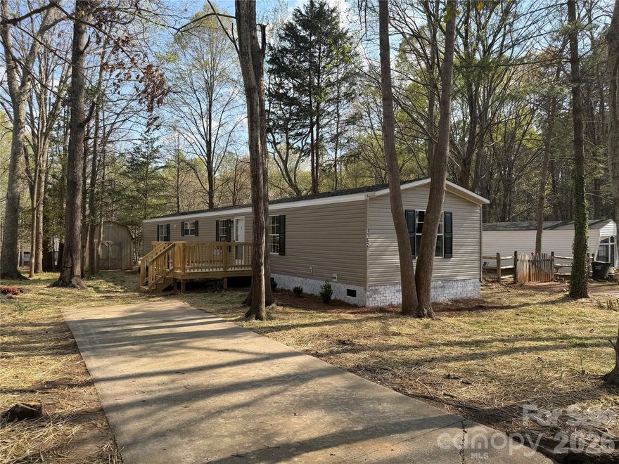 2010 Year Model Clayton Manufactured Home Approximately 1140 Sq Ft New Roof, New HVAC, New Hot Water Heater, New Floor Covering and Paint, New Stainless Side by Side Refrigerator with Water and Ice, Dishwasher and Smooth Top Range, Primary Bath with Dual Sinks Vanity, Dual Closets, Soaker Tub and Separate Shower, Central Heat and Air, Vinyl Tilt Windows, Permanent Foundation Brick Underpinned, Nice Front Deck, Concrete Drive, Conveniently Located, Nice Partially Wooded .19 Acre Lot, Storage Shed,  Public Water and Sewer. Really Nice almost Complete Remodel. Shows like New!