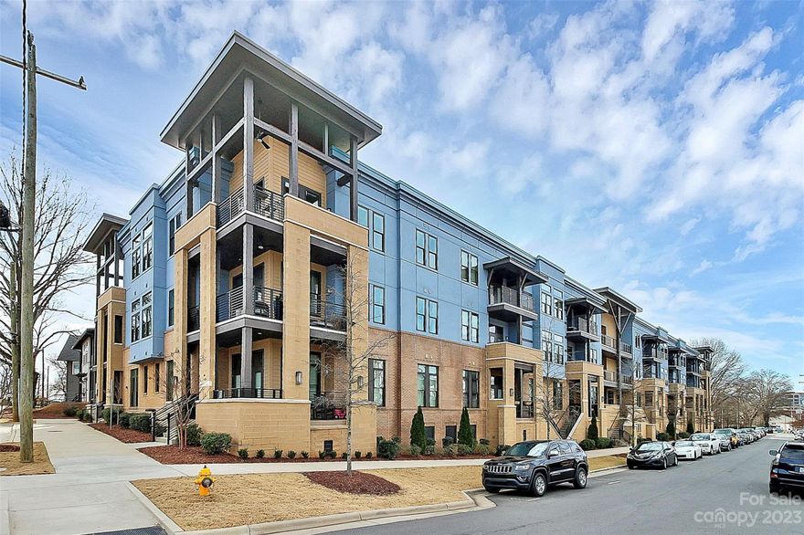 Experience luxurious and carefree living in this stunning first-floor 2 bed/2 bath unit nestled between Dilworth and South End. Surrounded by an array of dining options, breweries, bars, and grocery stores, this location offers unparalleled convenience. Step inside to discover 10 ft ceilings and exquisite wood flooring throughout the spacious open-concept layout. The gourmet kitchen boasts upgraded quartz countertops, a stylish backsplash, and a touchless Delta faucet. Entertain effortlessly in this inviting space before heading out for the evening. Enjoy privacy and ample space with the split bedroom floor plan, each featuring an en-suite bathroom and custom built-in closets. This gated community provides access to a courtyard with seating, grills, and a fire pit, as well as a well-equipped gym + cardio area. Additionally, the unit includes one deeded parking spot out front + another in the gated parking lot. Don't miss out on the opportunity to indulge in the finest South End living!