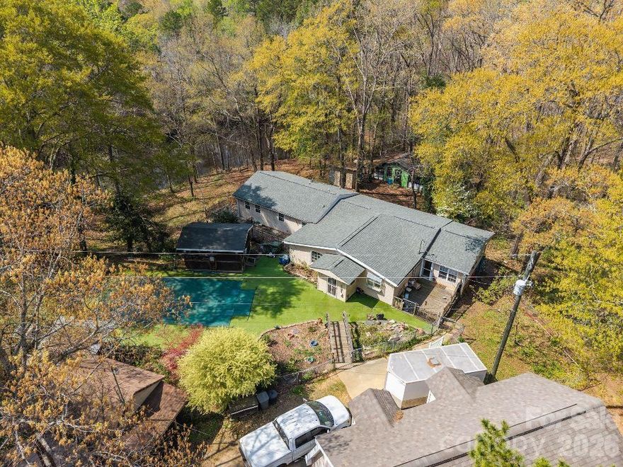 Don't miss this opportunity to own this charming home located on 2.89 acres!  This 3-bedroom, 3-bath home offers the perfect blend of privacy, space, and convenience all located in the well desired Fort Mill/Indian Land area (and no HOA restrictions)  — just minutes from schools, shopping, and everyday essentials.

Inside, you’ll find a functional and inviting one-level layout with a fully equipped kitchen and ample cabinet space. The sunroom is filled with natural light and provides a cozy spot to enjoy your morning coffee or unwind at the end of the day.  The primary bedroom features a large walk-in closet and ensuite bath which thoughtfully includes accessible features.  New roof installed in January 2026.

Step outside and discover your own retreat, great for entertaining or relaxing.  From the screened-in gazebo, take a look at the picturesque in-ground pool with optional heating. 

There’s no shortage of extra space!  A detached two-story 30x24 garage offers parking below and a workshop upstairs—ideal for hobbies, bonus living space or future projects. You’ll also find an outdoor storage shed with electricity and an additional structure previously used as a dog kennel, giving you plenty of options for storage, pets, or creative use. The property even features a fully stocked pond and plenty of room for gardening, outdoor activities, or simply enjoying the peaceful surroundings.

Home is being sold AS-IS.  While the home could use a little TLC, it’s a wonderful opportunity to add your personal touches and truly make it your own. If you’re looking for space, charm, and the chance to grow into your dream home, this property is a must-see.  Schedule your showing today!