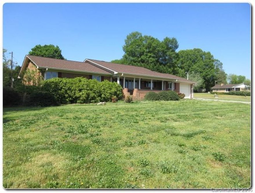 Fabulous full brick ranch home on a large corner lot! Inviting rocking chair front porch, large sized bedrooms and baths, gas log brick fireplace in the great room, and a detached workshop space!