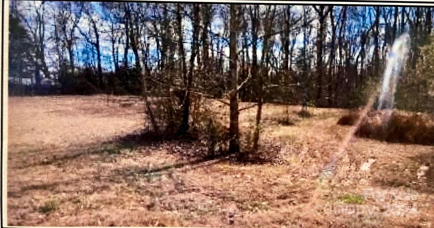 Great opportunity in the growing commercial area of Sherrills Ford.  This lot is Zoned residential but has potential for commercial zoning as well.  Buyer to verify with Catawba County any commercial options.  The lot has a home on it that has not ben lived in for over 14 years.  Will more than likely need to be torn down.