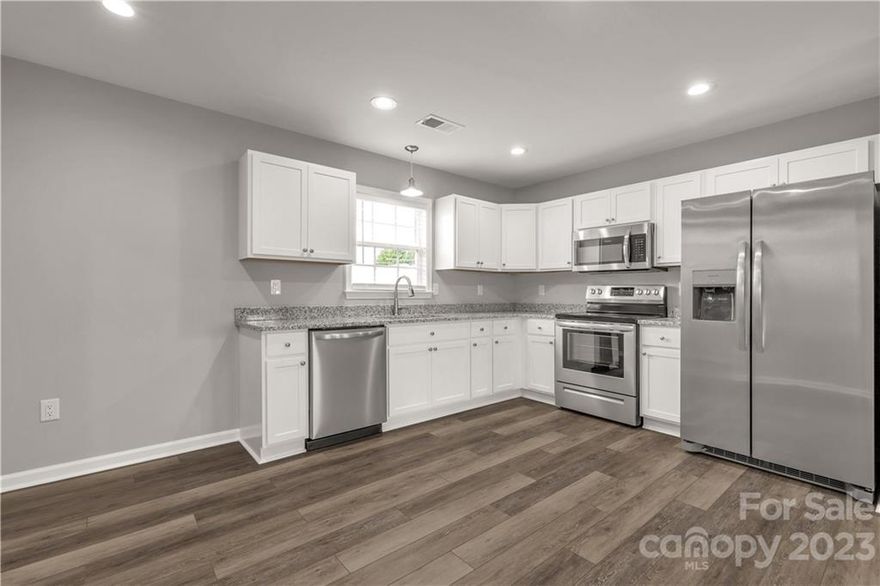 This is an exquisite new construction home with many upgrades in the heart of Kershaw!  This 3 bedroom, 2 bath home features solid wood cabinetry with soft close cabinet doors, granite countertops, stainless steel appliances, blinds throughout, ring doorbell, luxury vinyl plank flooring throughout the home (no carpet), prewired for Rivernet & cable, recessed lighting in the main living areas, & top grade paint.  You'll love walking into your brand new home that boasts a fresh neutral look that will accommodate any decor.  The master has a walk-in closet & double vanity. The laundry room has ample space furnished with cabinetry.  You'll also love the back patio and the flat backyard for all the summer cookouts.  This home is a must see!