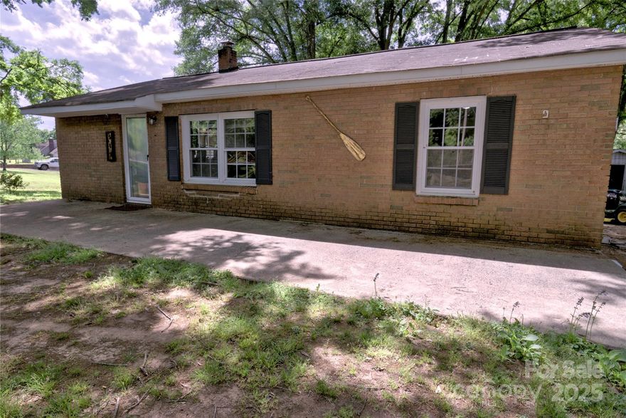 Great location for this brick and vinyl RANCH home that is less than 4 miles to Stanley shopping and restaurants! The floor plan has Living and Dining areas, an open Kitchen with white appliances, a Laundry Room, and a oversized Den. There are 2 Bedrooms and 2 Full Bathrooms, and another room that can be a Bedroom/Office space.  Enjoy mature trees and lot of space on an acre lot. The septic permit is for two bedrooms. Home qualifies for USDA and FHA financing per lender. Possible assumable loan.