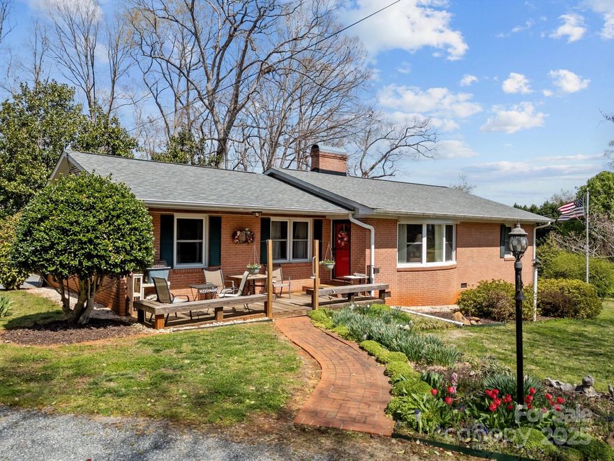Nestled on a picturesque 1+ acre lot, this charming 3 bedroom 2 bathroom brick ranch offers classic appeal with endless potential. Surrounded by mature trees and lush landscaping, the property provides a peaceful, private retreat while still being conveniently close to town. Inside you will find a very well maintained layout with ample natural light and an unfinished basement which offers limitless possibilities- extra living space, a workshop or even just additional storage space. The property also includes an old well house which is still functional and a barn with ample additional storage space. Roof was just replaced in 2024 and HVAC was replaced in 2023! Don't miss your chance to own a piece of tranquility in Forest City!