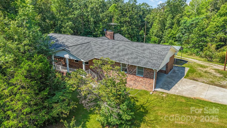 Beautiful Brick Ranch on 55 Acres with combination of trees and pasture! Bring your own vision and design to create the ultimate retreat, farm, or outdoor paradise. This charming home features 3 bedrooms and 2 full baths, a spacious living room, family room with a fireplace, sunroom, newly built deck, new HVAC in 2024 and approximately 18 acres of fenced property.