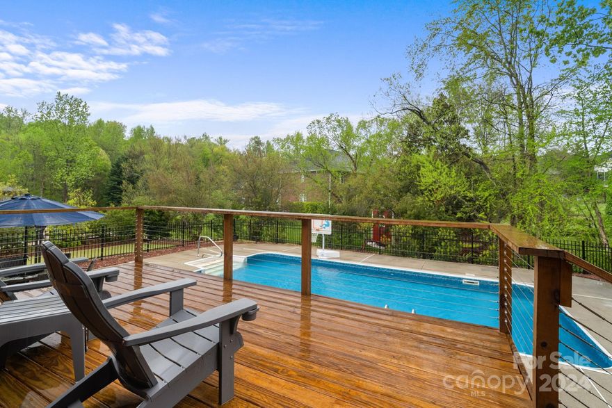 Welcome to Cramer Woods, just minutes from downtown Cramerton & Belmont! This well maintained home greets you w/ vaulted ceilings & an open floor plan allowing light to shine throughout the home. Fresh kitchen including, new flooring, freshly painted cabinets & hardware. The Primary bdrm & secondary primary bdrm w/ additional full bath are both conveniently located on main level. Beautiful real hardwoods run throughout main & up the stairs. Upstairs includes new carpet  throughout & 3 additional large BRs (one is enormous and could be second bonus/media room) and a full Bath. Back deck leads to the pool, providing an oasis for cooling off or unwinding under the stars in the evenings. Additional 384 ft shed in backyard w/ an irrigation system to ensure yard stays lush year round. Recent crawl space work includes new vapor barrier & vent work. Pool has motorized cover that you can stand on, new liner, motor, pump & filter! Offering a $3,000 credit to buyer to use as they please.