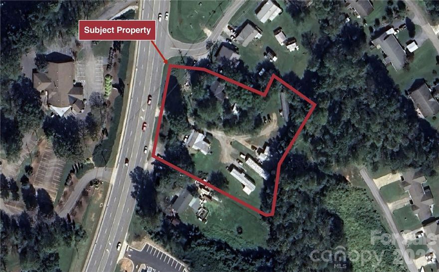 Positioned along a high-traffic corridor in Marion, this ±1.67-acre redevelopment opportunity offers strong visibility and flexible commercial potential. The site consists of two parcels with existing improvements, providing a functional footprint for repositioning or ground-up development. Located along Sugar Hill Road near national retailers such as Walmart, Starbucks, and Dunkin’, the property benefits from established consumer traffic and underscores the strength and stability of the surrounding trade area.

2 parcels totaling 1.67 acres:
1921 Sugar Hill Rd (MHP) PIN: 1700-18-7597
677 Stroud St (house) PIN: 1700-18-7774

Zoned C-2 (General Business), the property supports a wide range of uses including retail, grocery, QSR, office, and medical, making it well-suited for developers / users seeking a strategic location with accessibility and exposure.
••Highlights••Zoned C-2 (General Business) – flexible commercial use•High-traffic location on Sugar Hill Road (17,000 VPD)•Ideal for retail, grocery, QSR, office, or medical•Redevelopment or repositioning opportunity