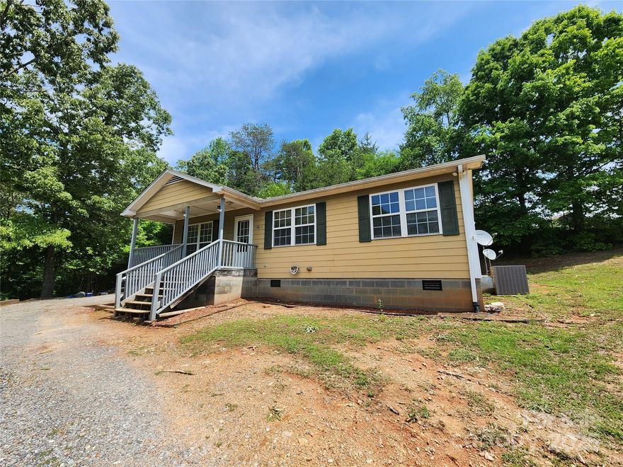 Motivated seller!  Will consider all reasonable offers.  This 3 bedroom, 1.5 bath manufactured home is situated on a hillside with plenty of mature trees surrounding it.  Enter through the covered front porch and enjoy the open floorplan.  The primary bedroom features an ensuite bathroom.  Enjoy the peace and quiet of country living.
