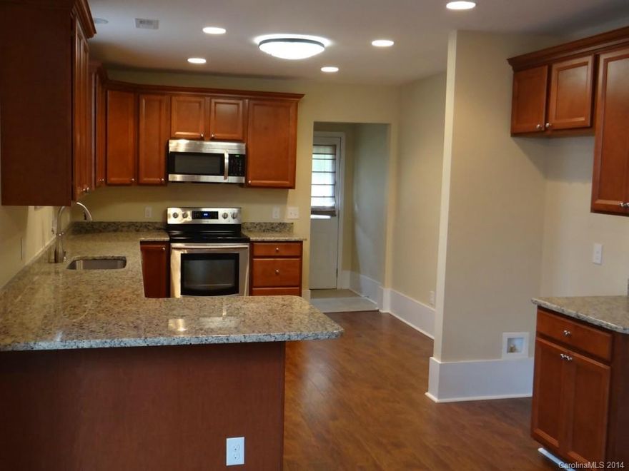 Completely renovated Bungalow Home. New electrical, plumbing, HVAC, windows, roof, flooring, stainless appliances, granite counter tops and more.  Home shows like a model.....move in condition.  Large fenced lot, wrap around front porch, mature landscaping.

A great combination of Historical Charm mixed with a quality renovation.