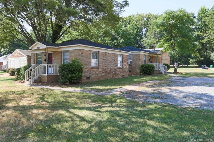 Investor special: Two rehabbed, all-brick units with tenants in place, generating $1,300 per month in cash flow. Both units are identical: Updated kitchen and bathrooms, rehabbed hardwood floors, new tile, new appliances, new roof, new air/heat units, new tankless water heaters. Mature trees in quiet neighborhood. Only two blocks from Scaleybark Rd. station on LYNX Blue Line.