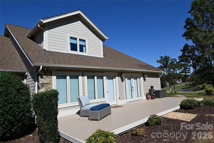 BEAUTIFULLY RENOVATED END UNIT TOWNHOUSE ON THE GOLF COURSE AT ROCK BARN GOLF & SPA! Rarely available, this stunning end-unit townhome offers prime golf course living on the 11th hole of the Tom Jackson course. The home's southern exposure fills the living space with natural light through the oversized French Doors, opening to a spacious deck, perfect for relaxing and watching golfers pass by. Inside, no detail has been overlooked. Renovations include new flooring, new kitchen cabinets and custom-built cabinetry in the living area as well as updated lighting, ceiling fans, and fixtures throughout. Two skylights enhance the bright, open layout with a soft tinted glow of natural light. Upstairs you'll find two guestrooms, a full bath, and an expansive walk-in attic with abundant storage. The two-car plus room for the golf cart garage is fully finished with pebble flooring. With exterior maintenance handled by the HOA, this move-in ready home makes enjoying life at Rock Barn effortless! Membership to Rock Barn Golf & Spa is attainable. Membership includes 36 Holes of Championship Golf across 2 Challenging Courses. Member access and pricing at the 20,000 square foot European day spa and café. Eight court tennis complex with four hydro (clay) courts and four hard courts as well as pickleball courts. Members only fitness center with access to personal training and complimentary classes. Upscale locker rooms with lounge, steam rooms, and saunas. Olympic-size pool complex and exclusive aquatic fitness classes. Elegant 24,000 square foot Clubhouse with casual and fine-dining options and 7 private Dining, Meeting and Event Spaces with discounted room rental for Members. Seasonal casual dining at our golf course or pool complex cafés featuring Live entertainment, dining, and social events. Contact membership at Rock Barn for pricing information.