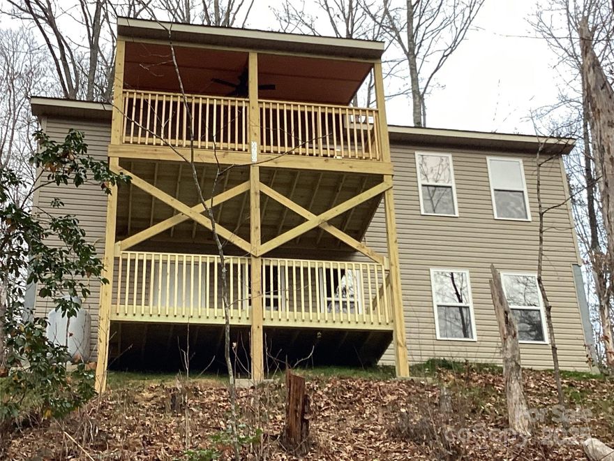 Brand new construction, near Smoky Mountain National Park and Cherokee. The house is at the end of a short, private road. Enjoy the quiet and beautiful mountain view. Open floor plan on main level with knotty pine ceilings, cabinets, doors, and trim. Floors are luxury vinyl plank throughout home. Main level has deck off living room area. The primary bedroom has an en-suite bath with tiled shower, double sink vanity, and huge closet. The kitchen has quartz counters and stainless-steel appliances. Lower level has open living area with separate space for office or third bedroom. Bedroom has wood ceiling, large closet, and bath with tub. Separate laundry room and utility room. Spacious decks off both levels. Separate Heat/ Ac unit for each level. Propane gas stove with logs. Quality stick-built home, low maintenance.