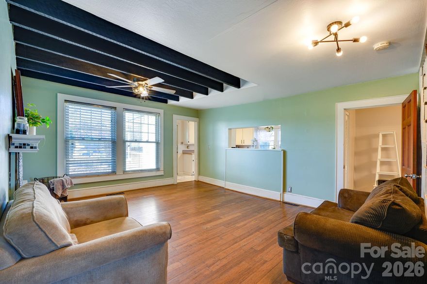 Get ready to fall in love with this mini charm farm! A very unique 1.5 story home on an acre and a half, bursting with character and ready to steal your heart! This 4-bedroom, 2-bath beauty brings the perfect blend of comfort and convenience, featuring a cozy living area that flows right into a well-equipped kitchen made for both weekday bustle and weekend entertaining.The main-level primary bedroom and full bath add a touch of easy living, while the upper level offers three additional bedrooms or flex space and a full bath—hello privacy and flexibility! 
Step outside and get ready to swoon over your own backyard escape: a tranquil fish pond, a chicken coop for fresh eggs, and a gravel patio with a fire-pit that practically begs for s’mores and good company. Also, you'll enjoy the spacious front porch that gives plenty of space for rocking chairs and even a porch swing. Plus, you’ll enjoy a 2-car carport with extra parking for 3+ vehicles, and no HOA which means no restrictions! Most recent updates: roof (2025), upstairs Mini-Split (2025), downstairs HVAC (2022), septic system maintained (2022), and new plush carpet upstairs (2025). Just minutes from Sherrill's Ford, Lake Norman, and I-40, this move-in-ready gem has all the charm, all the character, and all the reasons to say yes.