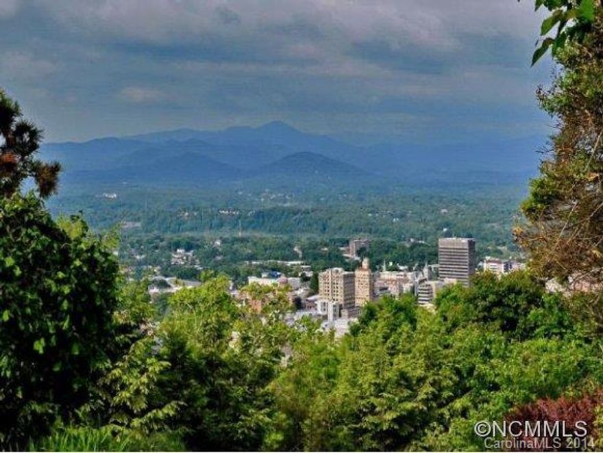 Fantastic long-range, year-round views of Downtown Asheville, all mountains to West, South, & SE w/800SF of outside living space w/patios, decks & covered decks. Updated kitchen w/granite & new appliances, new heat & air, new tankless water heater & roof. View from most every room, large back deck partial-covered, professional landscaping. Also included are lots on either side of home. PIN #9649-83-4386 & 2353. Private setting 5 min to Downtown.
