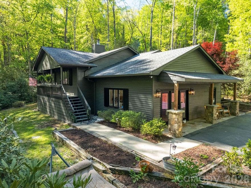 Turn-key mountain retreat in the heart of Western North Carolina, perfectly positioned to enjoy everything that makes the Appalachian lifestyle so special. Welcome to 492 Falls Creek Road in Pisgah Forest, where rustic modern charm meets thoughtful renovation in a private, wooded setting just minutes from it all.
This beautifully updated 3-bedroom, 2-bath home offers approximately 2,287 heated square feet and has undergone substantial recent improvements, making it truly move-in ready. Inside, you’ll find a fresh and inviting interior highlighted by a renovated kitchen with new cabinetry, two completely updated full bathrooms, new paint throughout, and much more. The flexible lower level has been enhanced with new lockers and a custom built-in cabinet, offering functional storage and versatility for everyday living or recreation. A new window in the flex room adds even more natural light, while a new garage door (2025) completes the list of upgrades.

The home’s layout is both comfortable and adaptable, featuring a light-filled all-season room that brings the outdoors in year-round. Step outside to enjoy a new deck, a spacious back porch ideal for relaxing or entertaining, and a welcoming covered front porch with attractive rock work accents that enhance the home’s mountain character.

Set on a wooded lot, the property offers exceptional privacy while Falls Creek gently runs along the front—creating a peaceful, storybook setting that defines mountain living. This location is highly sought after for its rare balance of seclusion and convenience, offering a private escape just minutes from downtown Brevard and no city taxes.

Adventure is right outside your door with easy access to DuPont State Forest, Pisgah National Forest, and Cedar Mountain, home to world-class hiking, biking, waterfalls, and outdoor recreation. Travel is equally convenient with Asheville Regional Airport less than 30 minutes away.

Separated from downtown Brevard by the iconic French Broad River Valley, this property offers the feel of a true forest retreat while staying closely connected to the vibrant culture, dining, and charm of town. A 2-car detached garage adds additional functionality to this already exceptional offering.

Whether you’re seeking a full-time residence or a mountain getaway, this fully renovated forest oasis delivers the best of Western North Carolina living. Schedule your showing today.