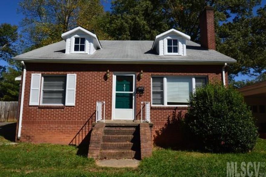 Brick bungalow with some hardwood floors would make a great starter home.