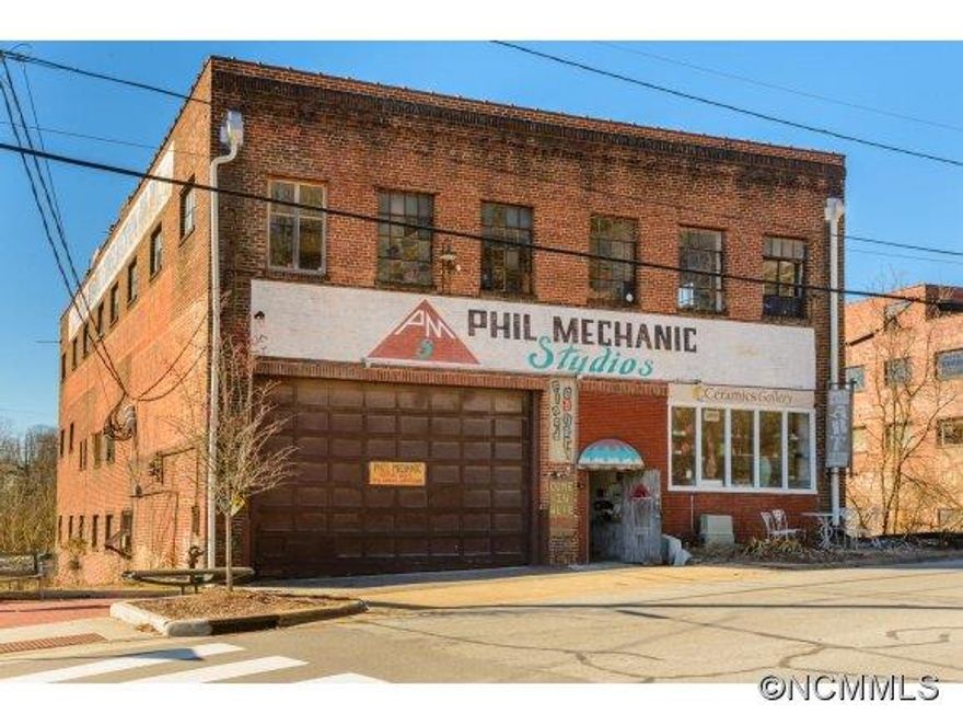 In the Heart of River Arts District, the Phil Mechanic Studios building is comprised of 5 floors, freight elevator, 3-phase electrical power, 2,000sqft side patio, loading dock and parking lot (extra .15 acre lot across the street). Currently 70% of the gross area is leased. Entire building under went major renovations in 2005 for code compliance. See Listing Brochure for further information.