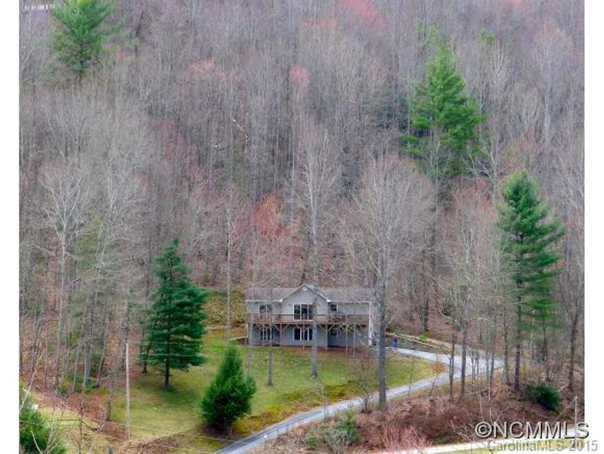 MOVE-IN READY! Beautiful Mountain Home in a peaceful Waynesville/Maggie Valley setting. Open floor plan with master suite on main level.  3 bedrooms/3 baths with second master suite and family room with fireplace on lower level. Deck on main level with mountain views. Enjoy all that the mountains have to offer and a convenient location with easy access to Maggie Valley, Waynesville, and Asheville. Second lot included. All this for $200,000.