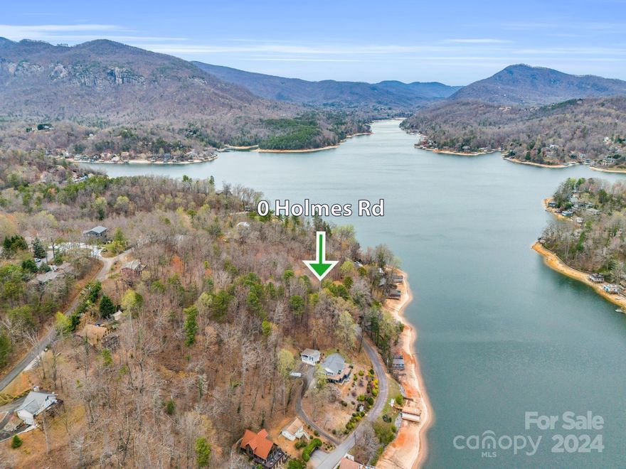 Year round mountain and lake views can be had on this 0.6 acre lot above beautiful Lake Lure with minimal restrictions. This lot gives way for sunrises across the lake in the front and simple beauty all around.  Conveniently located off Memorial Hwy for easy access to all that Lake Lure has to offer as well as nearby Chimney Rock. Plus, other destinations within an hour are Hendersonville, Asheville (airport & Biltmore House, etc.) plus from hiking, biking, boating, ziplining, golfing or just whatever your heart desires. You won't be having to build off a cliff on this one, yet you will have fantastic views.