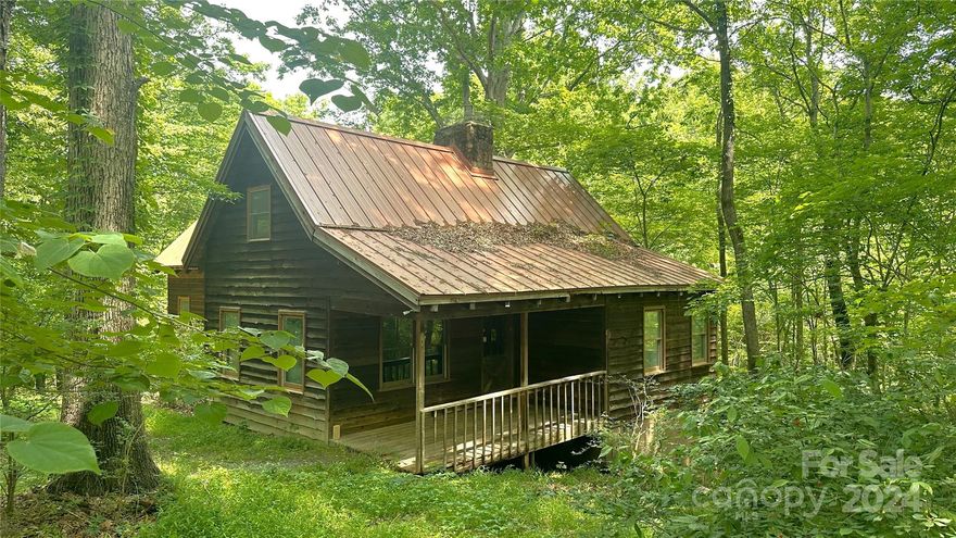 Tucked away on a secluded 3-acre tract resides a rustic cabin feeling bungalow. Inside this 1 ½ story, 1,693 sq. ft. home you’ll find a spacious 2-story den with rock fireplace and gas log stove, a generous bedroom with bathroom and ample kitchen on the main level. Both the den and adjoining bedroom have a fireplace. The upper level consists of a cozy bedroom and a loft area overlooking the den below. The upstairs bedroom closet is plumbed for a bathroom if desired. This property is being sold "AS IS".