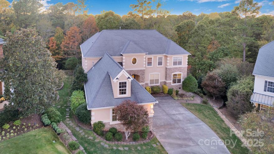 Amazing VALUE! Welcome Home to this golf course estate in sought after Waterford Glen! A premier 18-hole golf course community with a pool, just minutes from Riverwalk, and all of your conveniences for shopping and restaurants. Situated at the end of a cul-de-sac and between the 15th and 18th holes. Stunning 5-bedroom, 4-full bath offering timeless elegance and modern comfort. Designed for flexibility, the home includes a spacious theater room that can serve as a bonus suite or 6th bedroom. The main-level primary en-suite features a beautiful coffered ceiling, an expansive walk-in closet, and a spa-like bath. A second bedroom or office on the main level adds convenience. The heart of the home is the two-story great room, filled with abundant natural light and a cozy gas fireplace flanked by built-in shelving. A separate dining room and sitting area offer elegant spaces for entertaining. The gourmet kitchen features granite countertops, double oven, kitchen island, stainless steel appliances, a walk-in pantry, abundant cabinetry, and breakfast room overlooking the private wooded backyard.  Upstairs, includes three additional bedrooms, two full baths, a large sitting area or library, and a huge theater room! Enjoy outdoor living on the screened in porch and deck overlooking private woods and the golf course, plus a lower paver patio and landscaped garden beds. The three-car garage adds luxury, convenience and value. This home offers so much privacy with over half an acre, woods to explore, the pool is walking distance, and sidewalks throughout the neighborhood. Bring your vision and creativity to transform this space into the home you have always imagined.