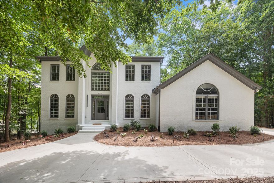 Experience the pinnacle of luxury lakefront living w/this extraordinary Lake Norman waterfront estate. Set on 1.11 acres, this 5,339 sq. ft. masterpiece offers 4 bd, 6 ba & 3 versatile flex rooms in the finished basement. This exquisite property features a private dock w/stylish gazebo & sandy beach, creating the ultimate lakeside experience. The main-level primary suite features a fireplace, stunningly remodeled en suite bath, sitting area w/wall of windows overlooking the lake. The grand 2-story great room showcases floor-to-ceiling windows & striking fireplace. A chef’s dream kitchen includes high-end appliances, walk-in pantry & breakfast area w/a view. Enjoy a formal dining room, custom library & renovated laundry. Upstairs, each bedroom boasts a private en suite. The finished basement offers a wet bar, game area & media-ready space. Outside, the upper deck provides the perfect setting to enjoy LKN sunsets or relax on the lower porch sauna or jacuzzi. A must-see waterfront home.