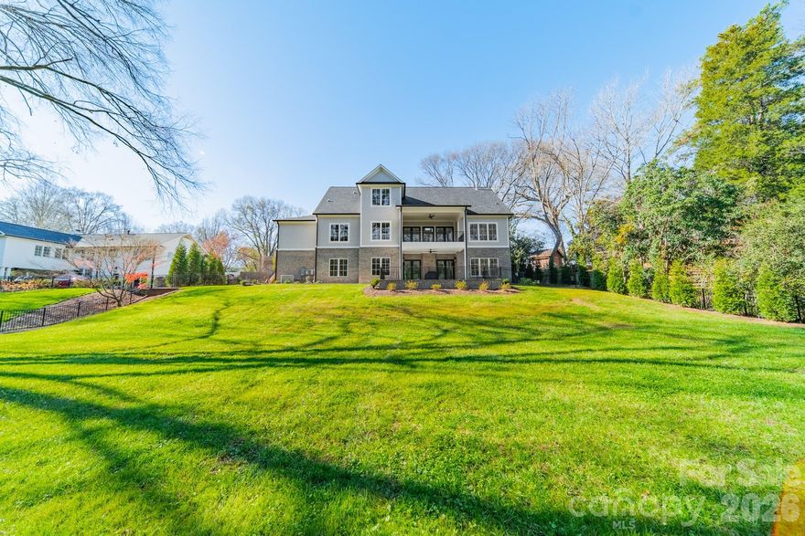 Beautiful newer construction in Providence Park on a private .6-acre lot. This charming cottage–style home offers 3 levels of living space, 6 BR/6 BA, covered front and back porches, and 2 attached garages (2- car and a separate 1-car). Flooded with natural light, the open-concept interior features high ceilings (10' on the main and lower level) and 9’ ceilings upstairs. The gourmet kitchen offers SS appliances, quartzite countertops, a large island and walk-in pantry - opening seamlessly to the vaulted great room which flows into the dining area, and outdoor living space. The main-level primary suite is a true retreat, with luxury en suite bathroom featuring a soaking tub, separate shower, dual vanities, and walk-in closet. Upstairs features 2 bedrooms, a full bath, a bonus room, and a second laundry room. The lower level suite is thoughtfully designed for entertaining, wellness days or extended stays, featuring a family room with fireplace, kitchenette, wine cellar, exercise room, and a private spa experience with sauna and oversized walk-in shower,. Two additional bedrooms and ample storage complete this level. Outdoors, the fenced and landscaped backyard provides privacy and tranquility, enhanced with full irrigation and a whole-house generator - an exceptional finishing touch to this quiet setting convenient to Cotswold, Uptown and SouthPark.