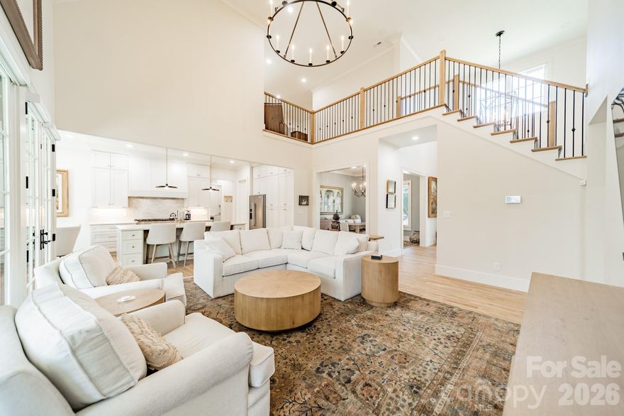 Beautiful newer construction in Providence Park on a private .6-acre lot. This charming cottage–style home offers 3 levels of living space, 6 BR/6 BA, covered front and back porches, and 2 attached garages (2- car and a separate 1-car). Flooded with natural light, the open-concept interior features high ceilings (10' on the main and lower level) and 9’ ceilings upstairs. The gourmet kitchen offers SS appliances, quartzite countertops, a large island and walk-in pantry - opening seamlessly to the vaulted great room which flows into the dining area, and outdoor living space. The main-level primary suite is a true retreat, with luxury en suite bathroom featuring a soaking tub, separate shower, dual vanities, and walk-in closet. Upstairs features 2 bedrooms, a full bath, a bonus room, and a second laundry room. The lower level suite is thoughtfully designed for entertaining, wellness days or extended stays, featuring a family room with fireplace, kitchenette, wine cellar, exercise room, and a private spa experience with sauna and oversized walk-in shower,. Two additional bedrooms and ample storage complete this level. Outdoors, the fenced and landscaped backyard provides privacy and tranquility, enhanced with full irrigation and a whole-house generator - an exceptional finishing touch to this quiet setting convenient to Cotswold, Uptown and SouthPark.