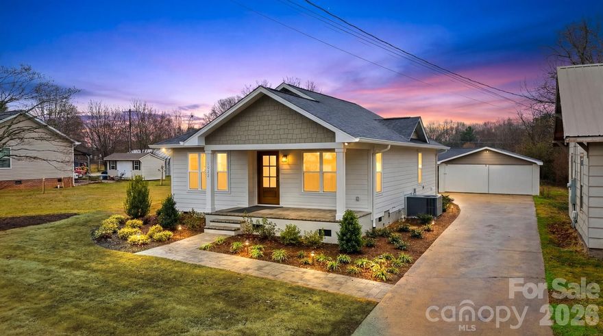 Completely rebuilt from the ground up, this beautifully finished 2 bedroom, 2 bath home offers the charm of an established area with the peace of mind of nearly all new construction. The home was reconstructed with new framing, new foundation work, all new electrical and plumbing systems, new windows, and high-quality finishes throughout.

Inside you’ll find custom cabinetry, quartz countertops throughout, solid wood interior doors, tile bathrooms, a beautiful glass shower in the primary suite, and a farmhouse kitchen sink with matching new appliances. Additional upgrades include recessed lighting, custom closet systems, pantry shelving, a laundry room sink, and a tankless-style constant hot water system.

Outside, enjoy a professionally landscaped yard with Bermuda sod, drip irrigation for the flower beds, and a paver walkway leading to a spacious backyard patio with built-in fire pit — perfect for entertaining. Underground power adds to the clean exterior aesthetic.

The property also includes a detached garage/workshop providing excellent storage or hobby space.

This home combines modern construction, thoughtful design, and outdoor living in a convenient Maiden location.