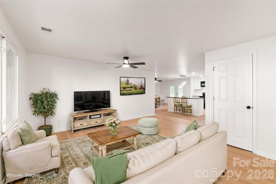 This fully renovated newly updated home with all new HVAC SYSTEM, AND DUCTWORK, WINDOWS, NEW ROOF,  LIGHTING, NEW GARAGE DOORS WITH NEW MECHANICAL GARAGE DOOR OPENERS, NEW FRONT YARD SOD, all new flooring, new drywall and paint, upscaled BATHROOMS with charming vanities, hardware, new tile surround work, faucetts & gorgeous new tile.  This house was renovated and the walls taken own to the studs to create a more open spacious home with an counter level island and seating for 3-4, with new pendants.  Create family fatherings around the island and two open areas that are great for entertaining a large crowd.  New deck, open to a large backyard with a canopy of trees for your summer events.  This home has newly added charm with a modern floor plan.  White Cabinets and generous cabinetry under the granite topped island with a corner cabinet lazy susan.  Everything in the interior of the home surfaces is fresh and new.  A well built home with new FINISHES THROUGHOUT.