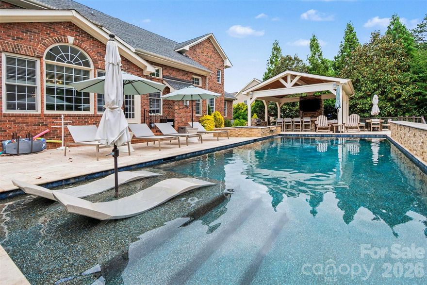Step inside this stunning all-brick estate offering over 5,800 square feet of beautifully designed living space, where timeless elegance meets resort-style comfort. From the moment you arrive, you’ll be captivated by the home’s stately presence, meticulous craftsmanship, and thoughtfully designed layout perfect for both everyday living and entertaining.  Inside, expansive living areas are filled with natural light and refined finishes, creating a warm yet sophisticated atmosphere throughout. The spacious floor plan offers generous room for gathering, relaxing, and hosting, with seamless flow from one space to the next.  Outdoors is where this home truly shines. Your private backyard retreat features a large pool and hot tub surrounded by plenty of space to lounge and unwind. The showstopping covered cabana is designed for year-round enjoyment, complete with a built-in grill, sink, and cozy fireplace—ideal for entertaining guests or enjoying quiet evenings at home.  This exceptional property offers the perfect blend of luxury, comfort, and outdoor living—an incredible opportunity to own a true retreat.
