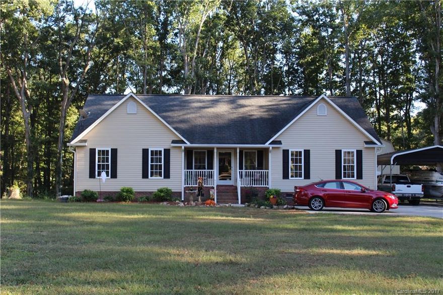 AMAZING  Home!  Beautiful hardwood floors, open floor plan, large bedrooms, trey and vaulted ceilings. Large lot to enjoy outdoor activities, beautiful deck, and inviting front porch  you choose which one you want to unwind on. Home offers a workshop to put all your cool stuff in, a great cement driveway, with a 2 car carport  and parking pad.  You don't want to miss this awesome home.