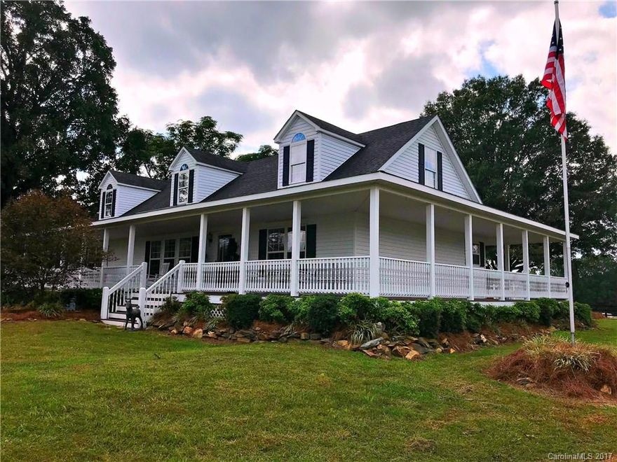 Welcome Home to Elegance, privacy & sophistication combined! Meticulously cared for horse farm home is located in the Waxhaw/Monroe equine communities in the Parkwood school district area. The house is an elegant 2,880 sq/ft, 2 story Cape Cod design built in 2005 that consists of 5 BR/3 BA, wrap around rocking chair porch, New HVAC unit with warranty, repainted interior, new carpet, master on main, gas fireplace. The 10 stall barn w/ tack room and wash bay, covered 4 car carport w/ workshop.