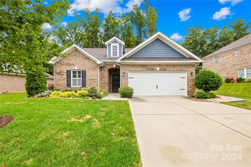 Welcome to this charming brick home featuring wood floors and an open floor plan with high ceilings. The inviting living room includes a cozy gas fireplace, while the kitchen is a chef’s dream with solid surface counters, a gas range with a double oven, and a tile backsplash. The main-level primary suite offers a vaulted ceiling, double sink vanity, updated shower, garden tub, and walk-in closet. The large upper-level bonus room, complete with a full bathroom, is perfect for guests or play. Plantation shutters throughout add privacy and elegance. Outside, enjoy a well-manicured, fenced backyard with a paver patio, custom fireplace, pergola, and storage building, ideal for entertaining and relaxation. Conveniently located near Uptown Charlotte, downtown Mint Hill, shopping, and dining.