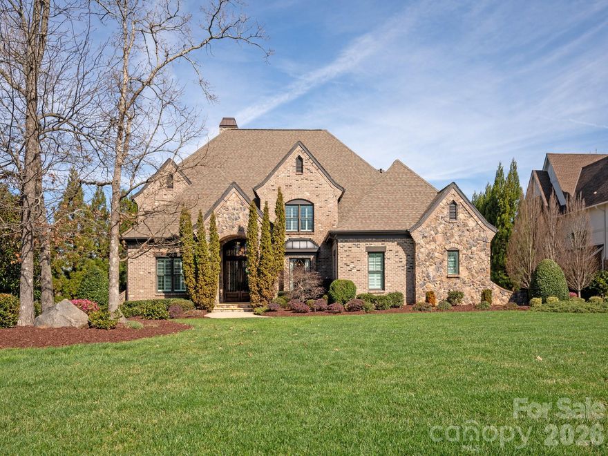 Welcome to this stunning 5 BR, 5BA estate home located in gated Providence Downs South. This remarkable property boasts a spacious 5779 square feet of living space, offering an abundance of room to live and entertain. Over an acre of land overlooking the picturesque pond! Upon entering, you'll be greeted by a grand foyer that leads into the open-concept living area, featuring HUGE family room.  Office has great built ins!  Guest bedroom is on the main with full bath.  The primary suite is a luxurious retreat, this walk in closet is unbelievable! Each secondary bedroom is well-appointed, providing comfort and privacy for family and guests. Step outside to discover a beautifully landscaped yard, perfect for outdoor gatherings and relaxation with outdoor fireplace, great covered porch, pool, spa, outdoor bar, pool bath and putting green. Why would you ever leave this private backyard?  Neighborhood amenities are world class with pool/fitness/tennis/basketball/playground.