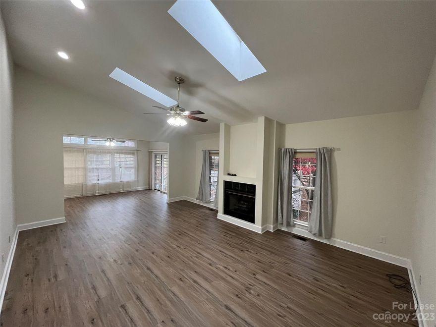 LOCATED ON FIVE ACRES! Don't miss out on this fantastic 3 bed, 2 bath, 2,100 sq. ft. all-brick ranch on a large, gorgeous lot of land with landscaping included! Located in the Woodland Forest community, this home features hardwood floors, vaulted ceilings and a spacious living room with skylights and a cozy fireplace with TV niche. The large, eat-in kitchen is adorned with quartz countertops, stainless steel appliances and a tile backsplash. Off the kitchen is a separate dining area with crown and chair rail molding. Your primary bedroom boasts walk-in closets and an en suite bathroom with dual vanities. Two additional bedrooms share a second full bath. The backyard deck and gazebo offer great outdoor space. Take advantage of additional storage with multiple sheds!