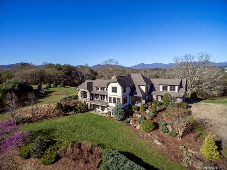 Magnificent home perched on a hill overlooking the entire 30 gorgeous acres with breathtaking 270 degree views of the surrounding mountains and valleys.  This property offers it’s owners the peace and tranquility of country life and the intimacy and relaxed elegance desired of a fine country home.  Located just fifteen scenic minutes north of downtown Asheville! Equestrian paradise! Build your stable and fences and bring your horses. Over 20 acres of existing pastures!