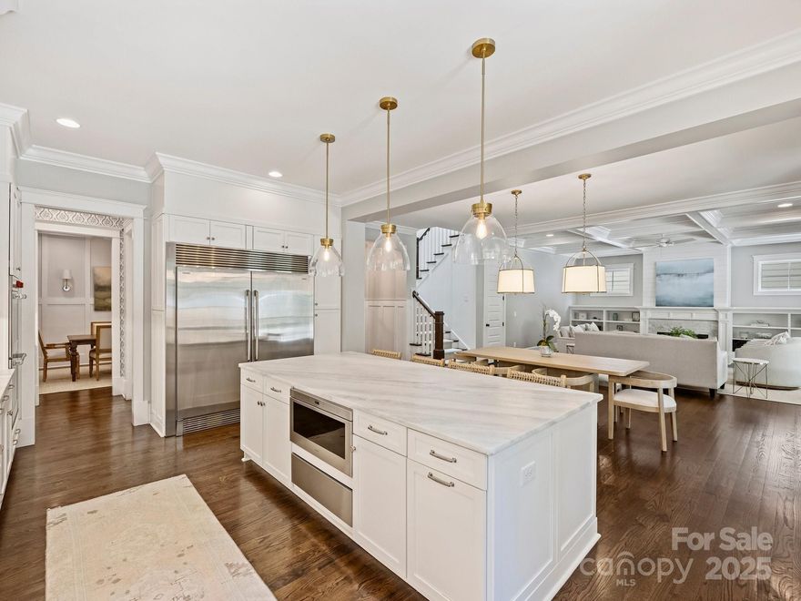 Welcome to this beautifully crafted home nestled in the heart of desirable Cotswold. Built in 2016, this thoughtfully designed property boasts over 4300 sq ft & features a gorgeous open floor w/elegant details throughout including custom built-ins,coffered ceilings,lovely moldings,high ceilings & beautiful hardwoods. Generous living & dining areas off of the Gourmet Chef’s Kitchen w/ wet bar & a versatile main-level office/bedroom alongside w/full bath. Upstairs, you’ll find four additional spacious bedrooms w/en suite bathrooms PLUS bonus/5th bedroom! Primary suite features walk-in closets,dual vanities & spa-like tub. Exquisite outdoor living on the screened in porch w/ fireplace, living and dining areas. Outside is an entertainers oasis w/ heated saltwater POOL & SPA! PLUS built-in grill area. Drop zone off of 3 car garage. Conveniently located just minutes from all the shopping and dining in Cotswold, & convenient to both Uptown & SouthPark. This one is a true gem, don’t miss it!