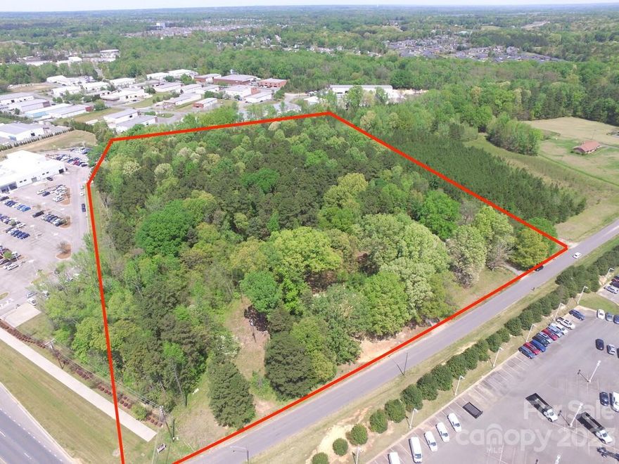 Excellent potential for this 15.14 acre site with a small amount of HWY 74 road frontage and the remainder on Helmsville Rd. This property is located between Crossroads Ford and the Nissan dealership.