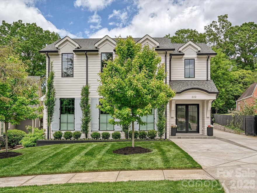 Thoughtfully designed for both everyday living and effortless entertaining, this beautifully appointed home offers a seamless blend of comfort and versatility. The main level features inviting gathering spaces, two fireplaces, a private office, and a well-equipped chef’s kitchen with 6 burner gas range, wet bar, walk-in pantry, and an oversized laundry room with additional refrigeration and wine storage. The primary suite is conveniently located on the main level with a spacious walk-in closet and bath featuring towel warmers and plumbing in place for a future soaking tub. Upstairs, generously sized bedrooms, walk-in closets, and en-suite baths are complemented by a large bonus/recreation room and additional laundry. A standout feature is the expansive, fully climate-controlled detached garage complete with a full bath, washer/dryer hookup, plumbing for a future kitchen, and fully pocketing garage doors—ideal for a guest suite, studio, or ultimate entertaining space. Outdoor living includes a covered porch and separate patio with custom wood burning fireplace, fenced yard, electric gate, irrigation system, new retaining walls with drainage, and available plans for future pool. Additional features include whole-home speakers, electric and manual top-down/bottom-up shades, encapsulated crawl space with dehumidifier, sump pump, and concrete driveway. A rare opportunity offering flexibility, thoughtful upgrades, and exceptional indoor-outdoor living. Walking distance to Selwyn Avenue shops, restaurants and Greenway and Selwyn Elementary, AG Middle School and Myers Park High School.