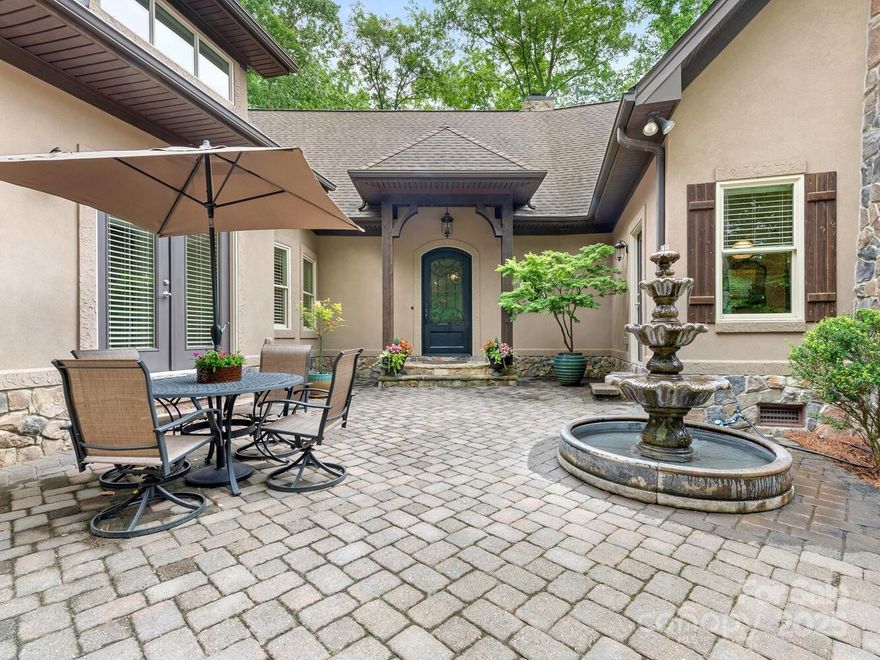 Beautiful 4 Acre Custom Home in Marvin has Old World feel, surrounding by Nature. This unique Valhalla Farms home offers a feel of Europe w/ its Courtyard Entrance, white oak wood hardwood floors throughout (except Laundry), Great Room w/coffered ceiling & stone woodburning fireplace is open to Kitchen & Dining Area. 3 Bedrooms w/ en-suite Baths & large WI closets on main level. Owners’ Suite has customized L shaped WI closet, separate tub & shower, vanity w/granite counters, dual sinks w/ storage between, & linen closet. Office space surrounded by windows, could also be exercise area has access to screened porch shared w/ Owners’ Suite. Kitchen island w/cabinets on 3 sides, w/Induction cooktop, double wall ovens, separate microwave, separate ice maker, filtered water faucet, granite counters, & WI Pantry. Dining Area surrounded by windows framing the beautiful outdoors. Enjoy your daily dose of nature w/ a choice of front or back patio! Unfinished walkup attic space. Generator Backup