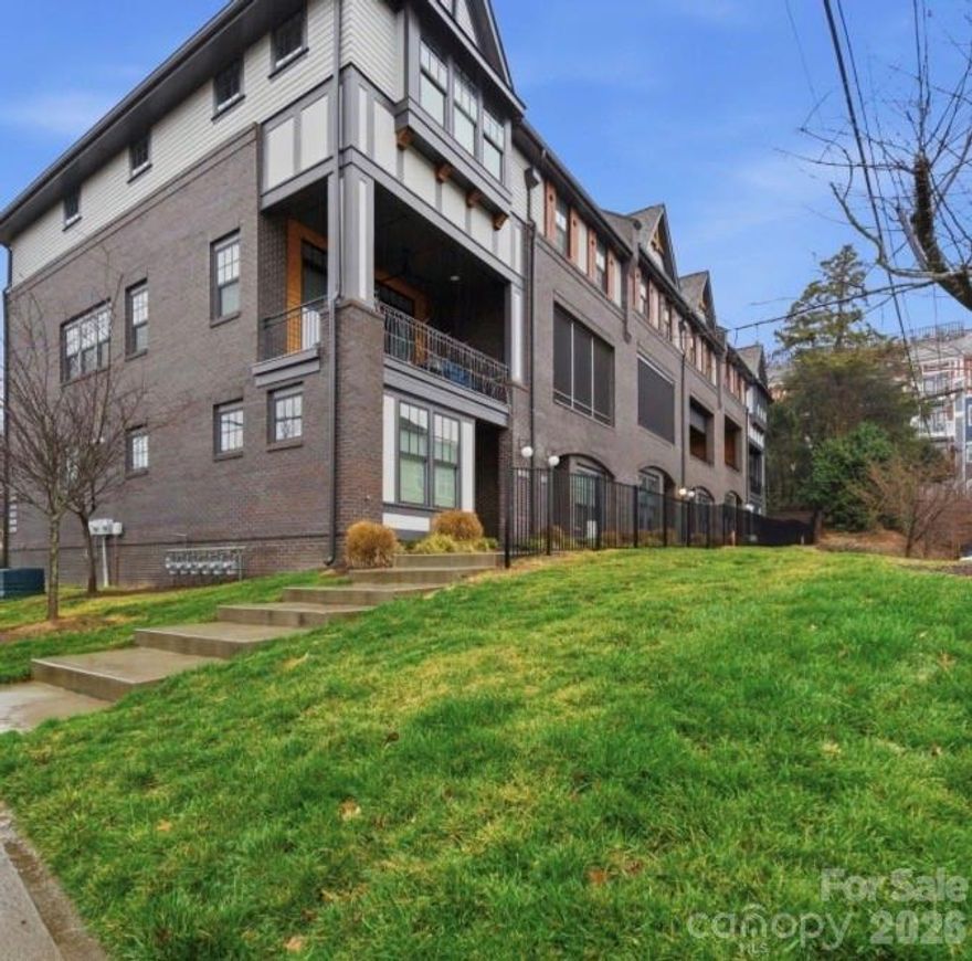 Beautifully crafted new townhome offering modern luxury in the heart of Elizabeth. This thoughtfully designed residence features an open-concept main level with 10-foot ceilings and hardwood floors throughout the living areas, creating a bright and inviting atmosphere.
The chef’s kitchen is a true centerpiece, showcasing a 36” dual-fuel range, white stacked cabinetry, a striking jade-green island, quartz countertops, and a stylish 3x12 charcoal tile backsplash—perfect for both everyday living and entertaining.
Upstairs, the spacious owner’s suite offers a serene retreat with a spa-inspired bathroom featuring a frameless glass shower, dual vanities, and a generous walk-in closet with custom site-built shelving. The secondary upstairs bedroom includes its own private full bathroom, ideal for guests or a home office setup.
The lower level provides additional flexibility with a third bedroom, full bath, and direct access to the two-car garage. Step outside to the patio featuring $5,000 custom installed privacy shade. Living in Elizabeth means easy access to South End’s light rail, the bustling energy of Uptown, green space along the Little Sugar Creek Greenway, and some of Charlotte’s most beloved restaurants and shops—all just minutes away.