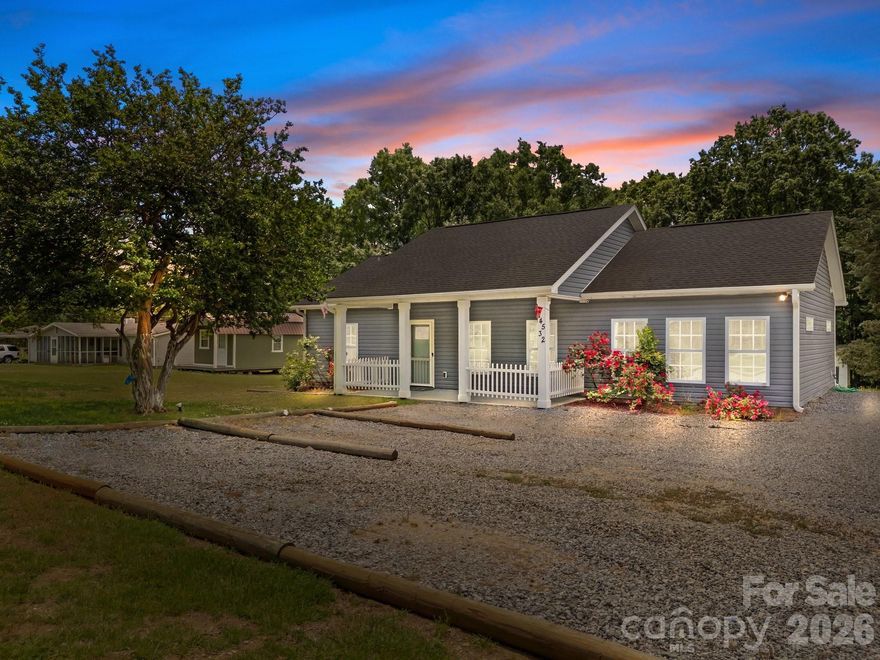 So many possibilities, live here, short or long term rental opportunity, or build your up to 5 bedroom dream home. This adorable ranch home was built in 2018. It is located just 5 minutes from downtown Davidson, and situated on an acre of land that is tucked between million dollar homes within the communities of River Run and Davidson Farms. The 3brd/2ba split floorplan grants privacy to the primary suite which has his and her closets. High ceilings make the open concept floor plan feel spacious. It has a beautiful level backyard and mature landscaping. The adjacent property at 14536 E Rocky River Rd is also listed for sale, which all together would be a total of almost two acres that could accommodate a total of two 5 bedroom homes. Potential investor opportunity! City water is available with a tap fee. Recent septic improvement permit issued for a 5 bedroom home. Or, you could add bedrooms to the existing system. Natural gas is available at the road. No HOA!!